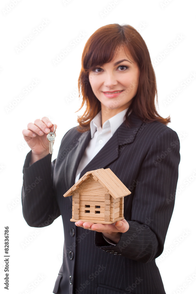 adult realtor with keys and wooden toy house,it could be the adult realtor with keys and wooden toy house,it could be the