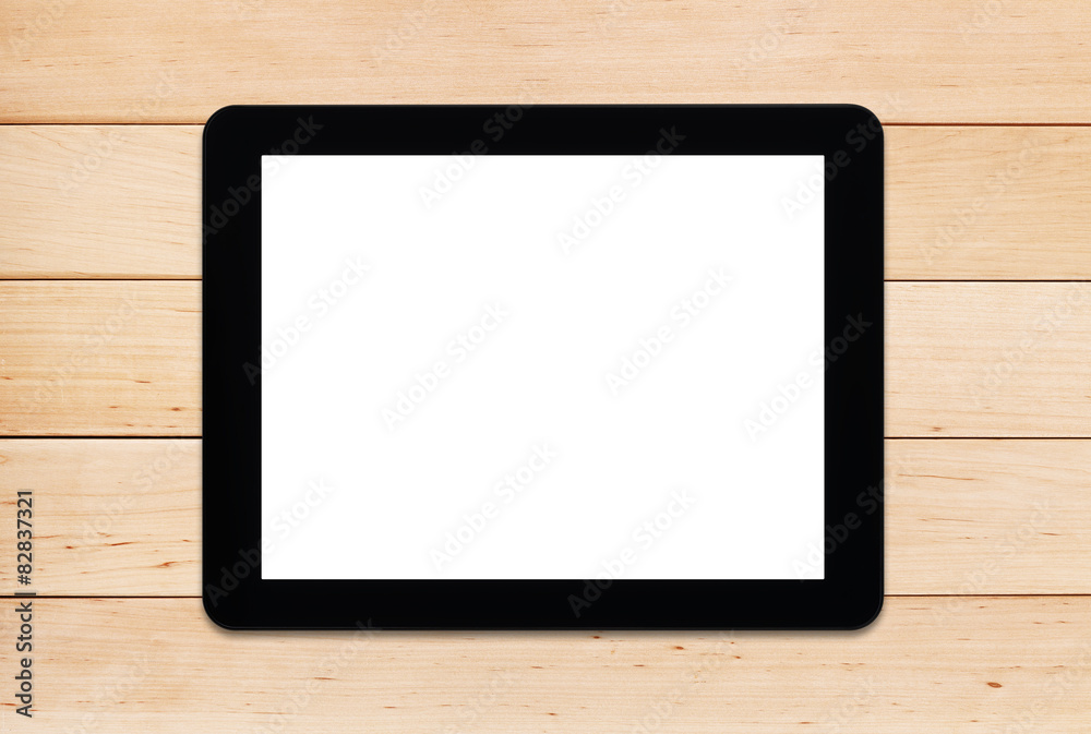 Tablet PC on a wooden table Tablet PC on a wooden table