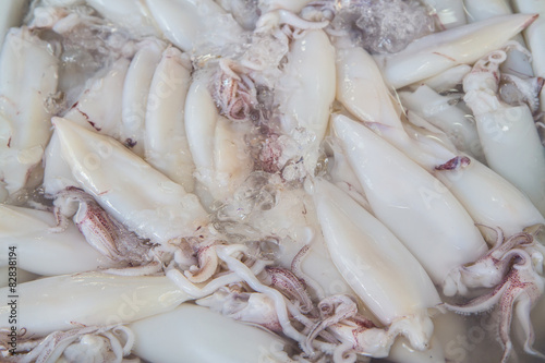 Fresh Squid pile up on ice at market ,Thailand,Top view