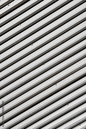 Angled, abstract view of the exterior wall of an industrial building.