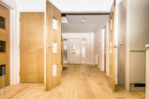Oak double doors through to entry hall.