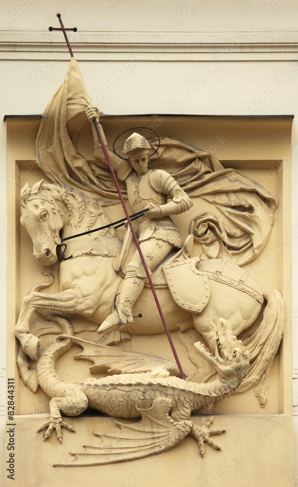 Obraz premium Saint George killing Dragon. Stucco decoration on Art Nouveau bu