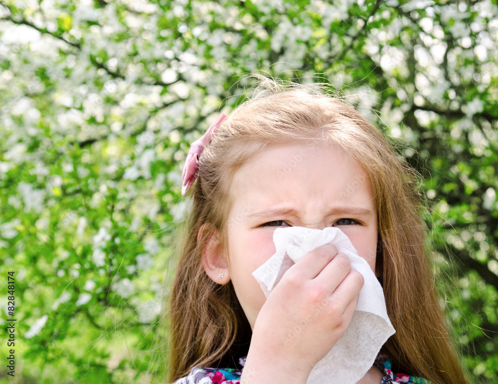 Little girl has allergy to spring blossoming Little girl has allergy to spring blossoming