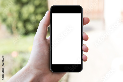 Man's hand shows mobile smartphone in vertical position, 