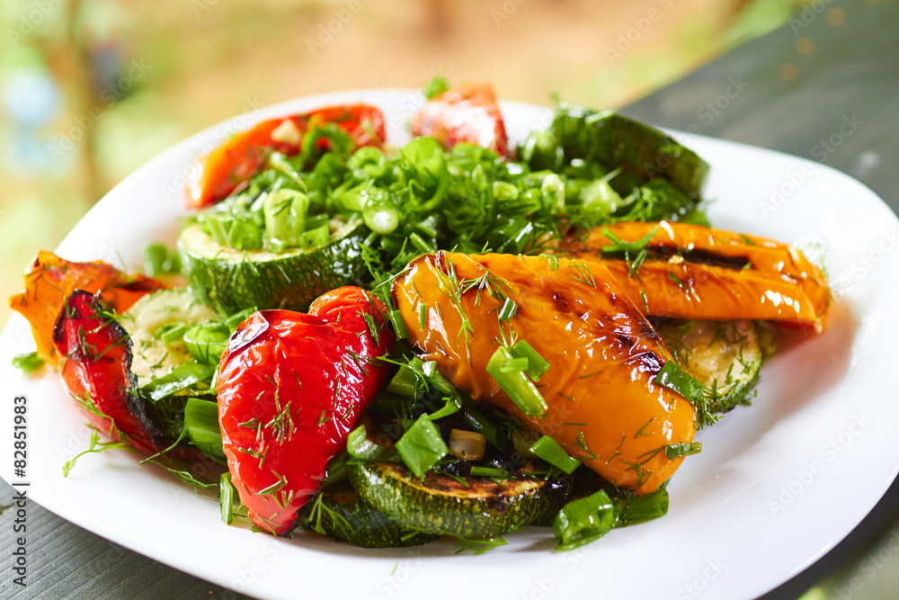 dish with grilled sweet peppers, zucchini, green onions and herb