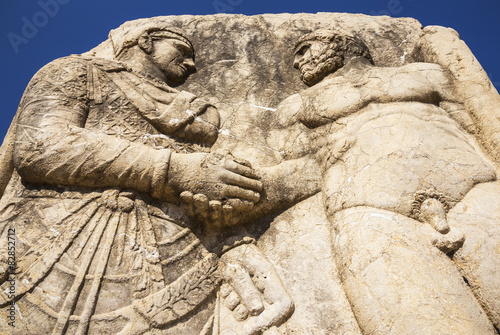King Mithridates shaking hands with god Herakles photo