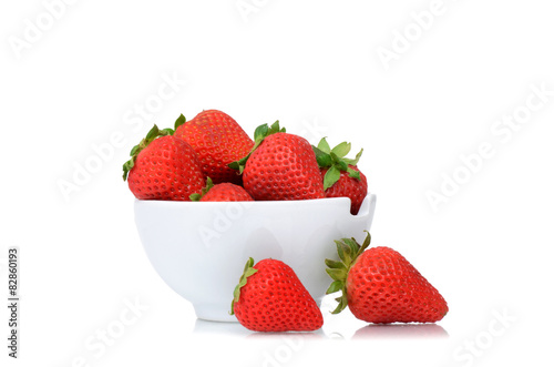 fresh organic strawberries in bowl isolated on white background