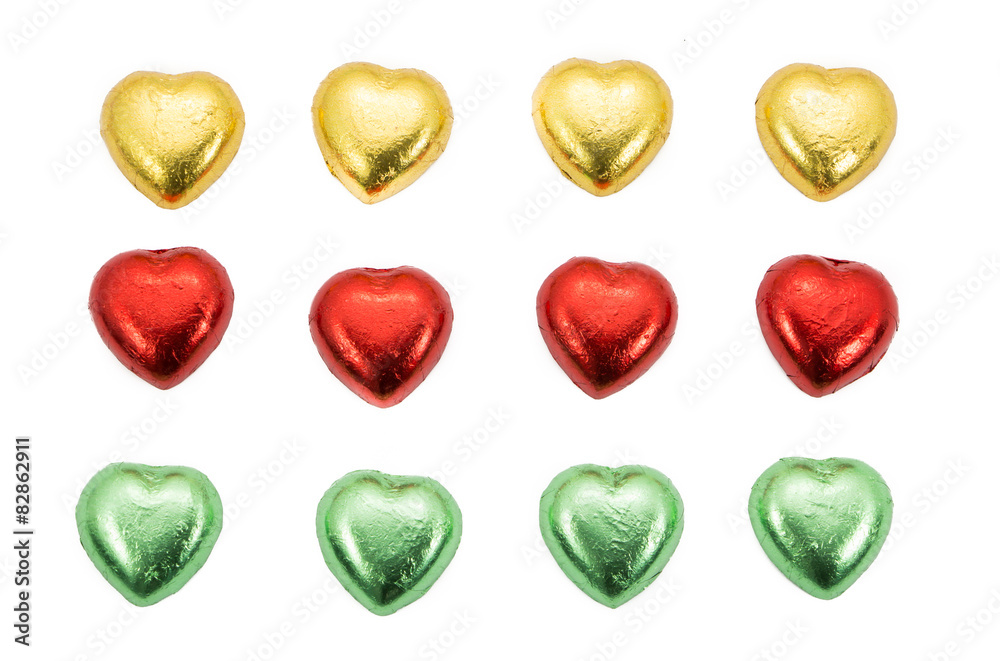 Fototapeta premium chocolate hearts candies on white
