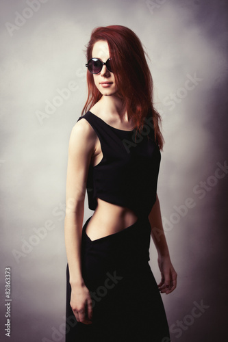 Portrait of style redhead women in sunglasses