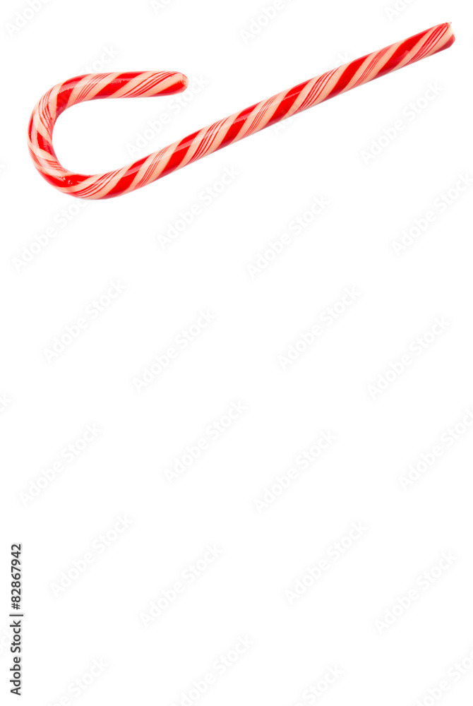 Fototapeta premium Christmas red and white stripe candy cane over white background