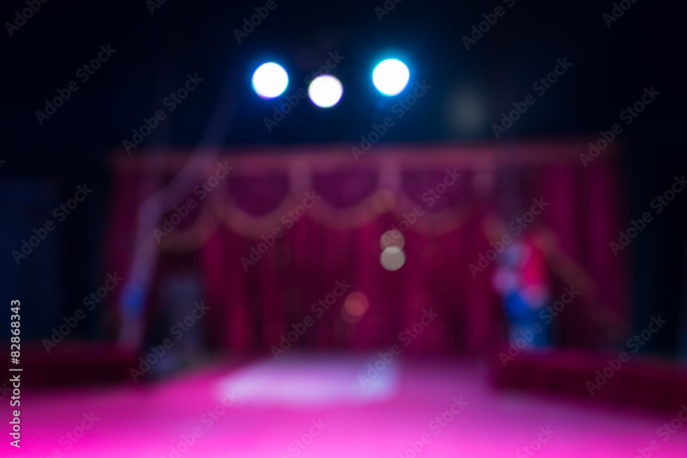 Indoor stage with spotlights and pink decor