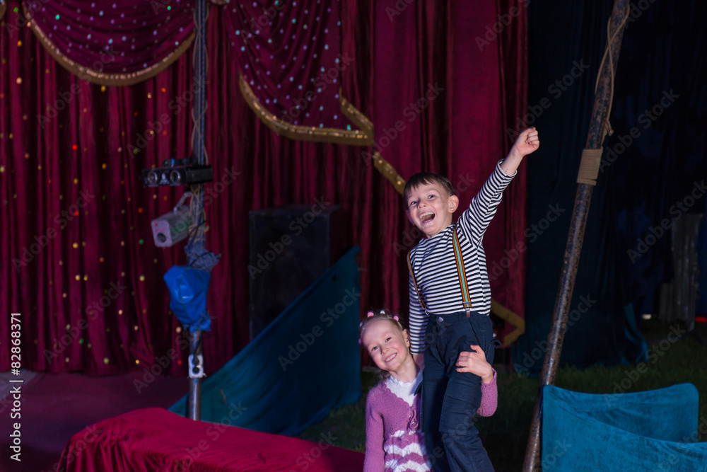Girl Lifting Boy Up on Shoulders on Stage
