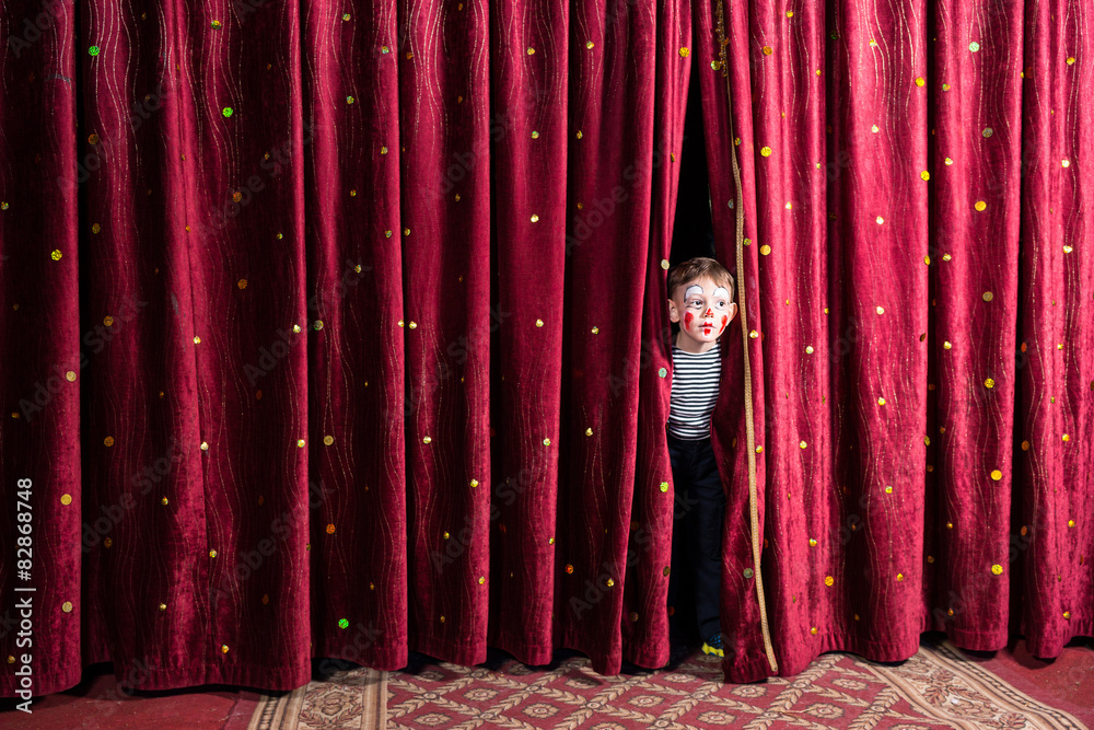 Excited little boy on stage