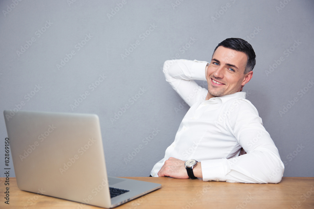 Businessman sitting at the table with laptop Businessman sitting at the table with laptop