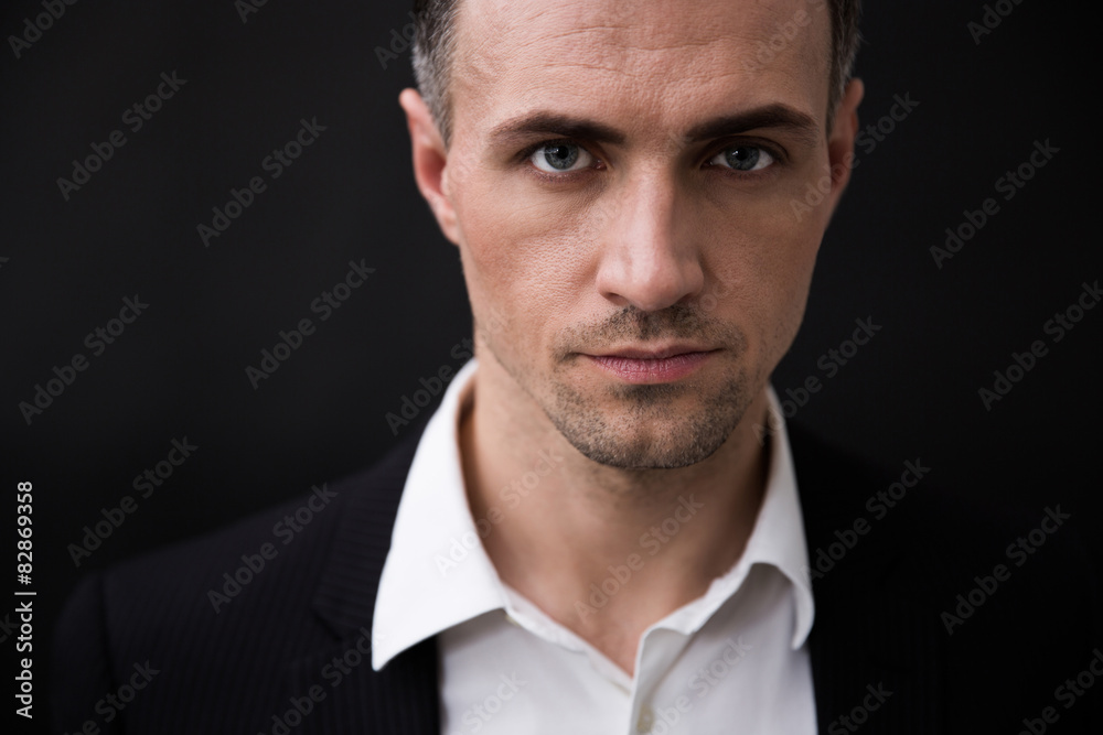 Confident businessman looking at camera