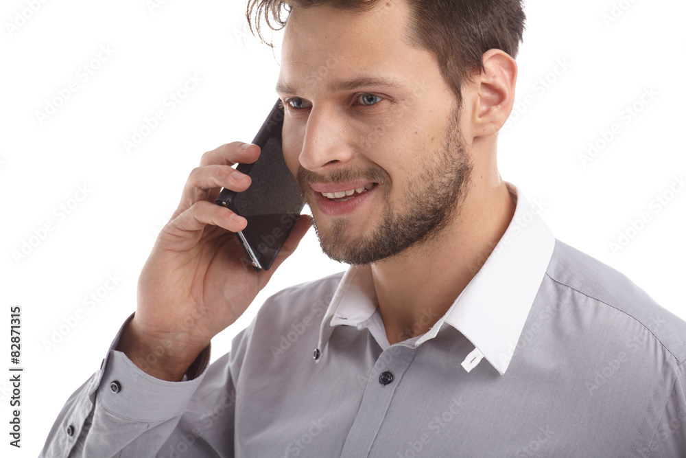 Young Businessman Talking over Cell Phone on Isolated White Back Young Businessman Talking over Cell Phone on Isolated White Back