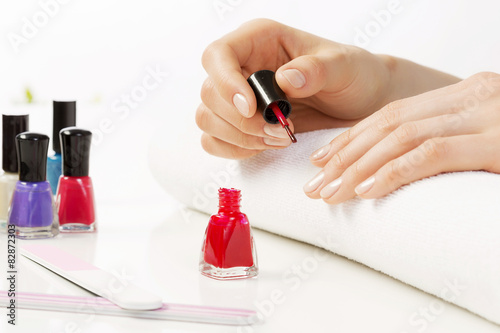 Woman applying polish