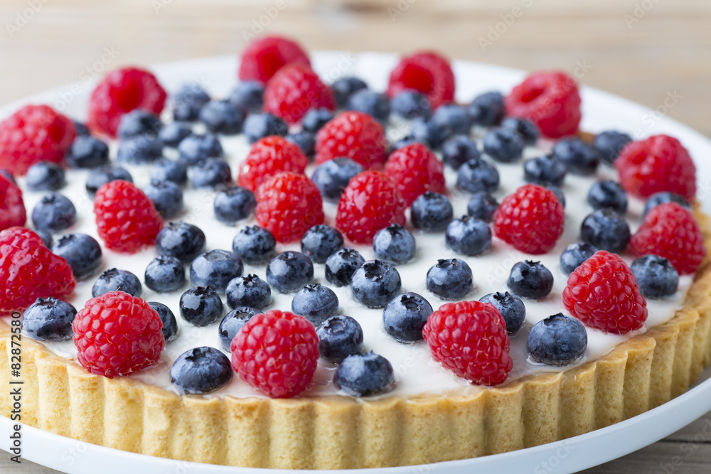 Cake with blueberries and raspberries. Confectionery product. Cake with blueberries and raspberries. Confectionery product.