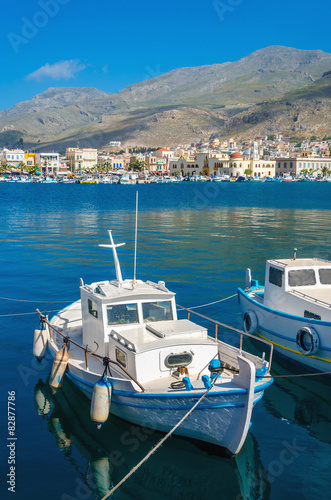 Small fisherman's boat in Greek blue and white colors in Phothia