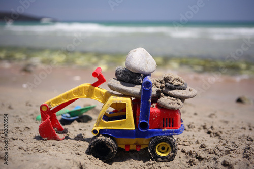 Beach toy with stones in sand, Thassos island, Greece 
