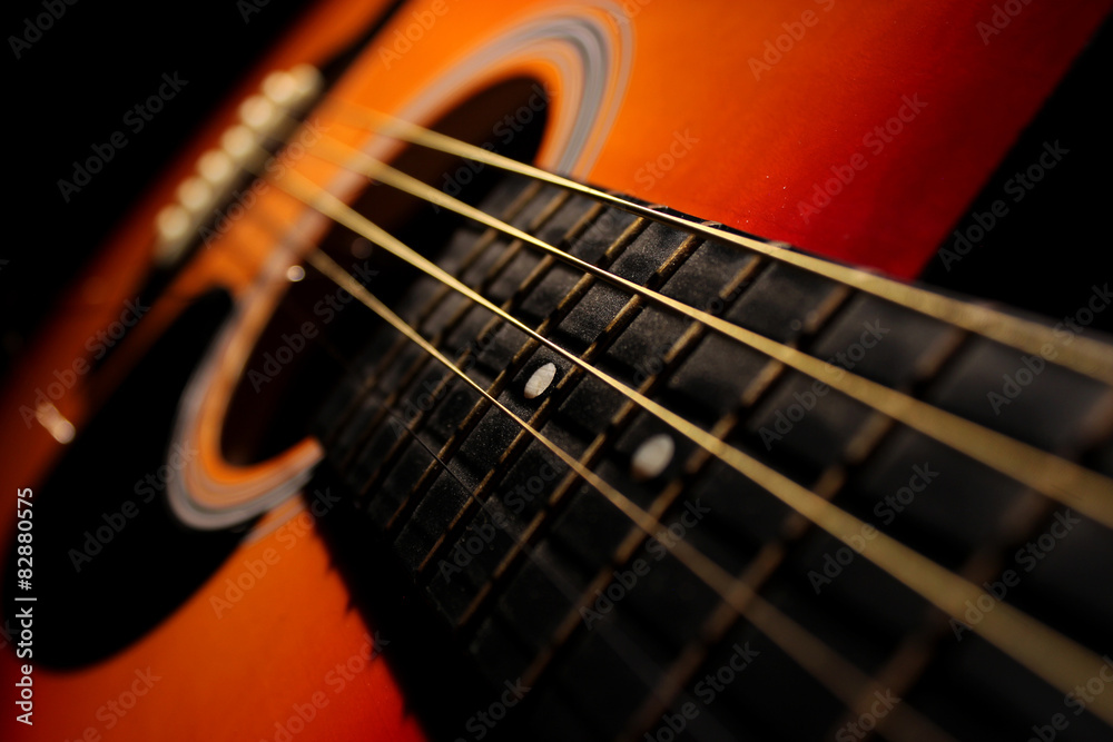 Fototapeta premium Acoustic guitar with focus on strings 