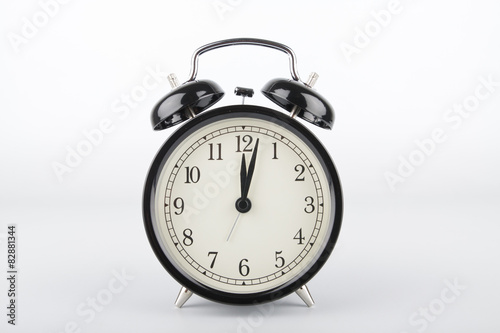 Two minutes past twelve o'clock. Alarm clock.