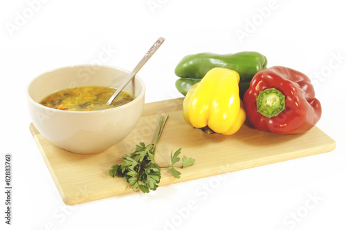Vegetable soup and colorful peppers