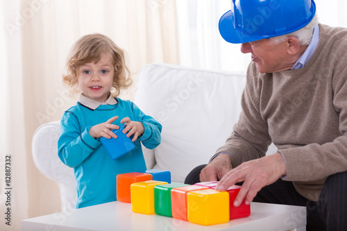 Toddler playing with colorful cubes