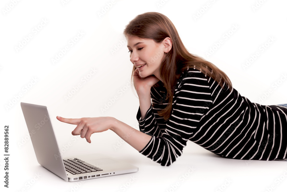 Young Smiling Woman showing PC Screen on Floor Stock Image Young Smiling Woman showing PC Screen on Floor Stock Image