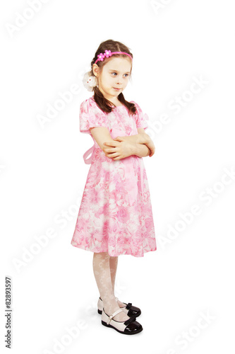Pretty cute young girl wearing the pink dress