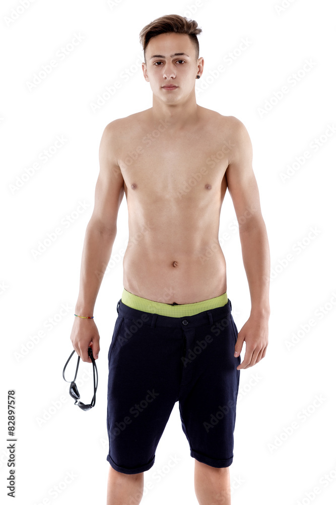 Fototapeta premium Portrait of a young man with swimming goggles on white backgroun