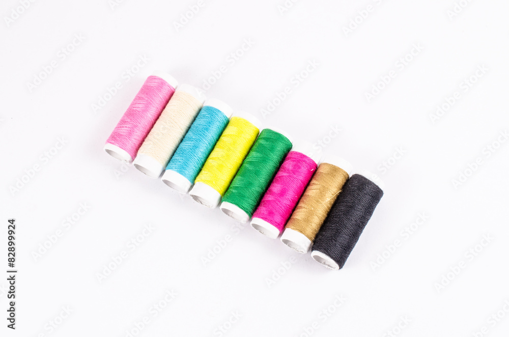 multicolor sewing threads on white background, multicolor sewing threads on white background,