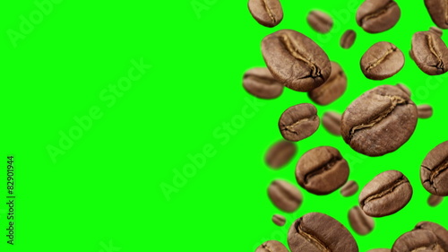 Coffee Beans falling down on green background