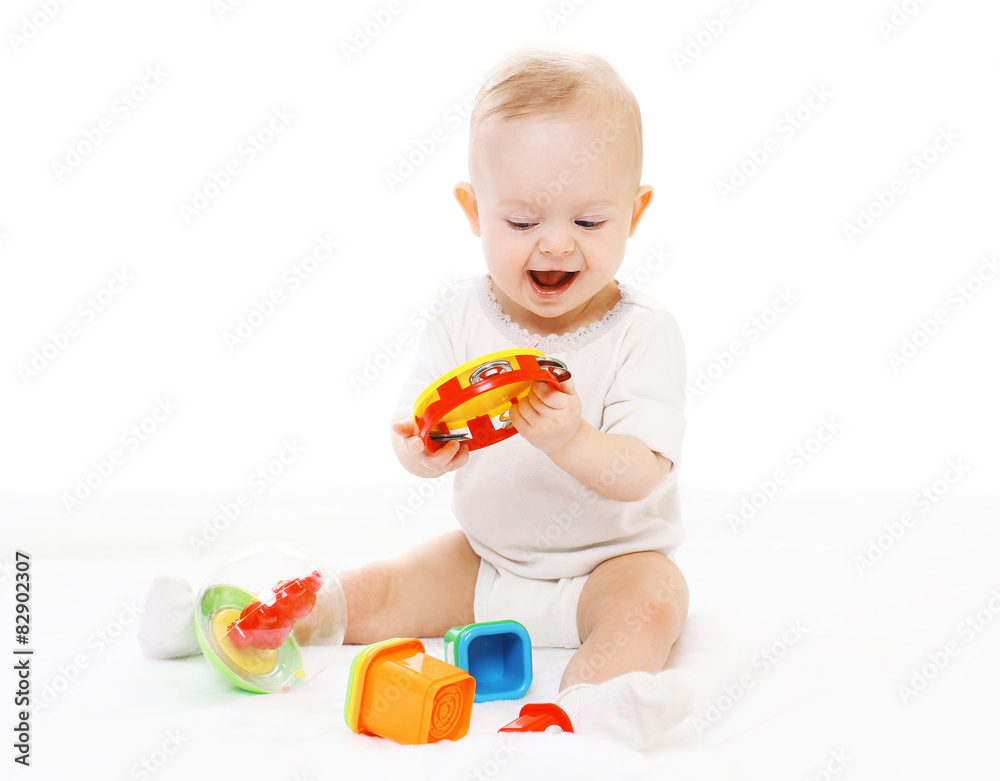 Cheerful baby in diapers playing with toys Cheerful baby in diapers playing with toys