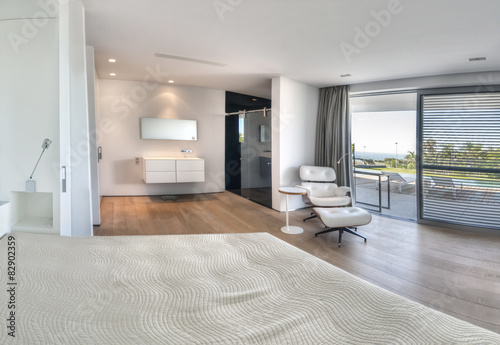 Modern white bedroom with bathroom