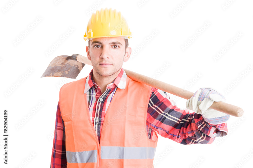Construction worker carrying a shovel on shoulder Construction worker carrying a shovel on shoulder
