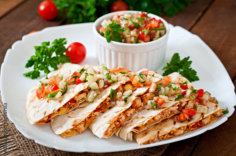 Mexican Quesadilla wrap with chicken, corn and salsa Mexican Quesadilla wrap with chicken, corn and salsa
