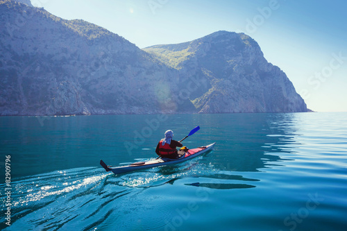 Kayak. People kayaking in the sea with calm blue water.