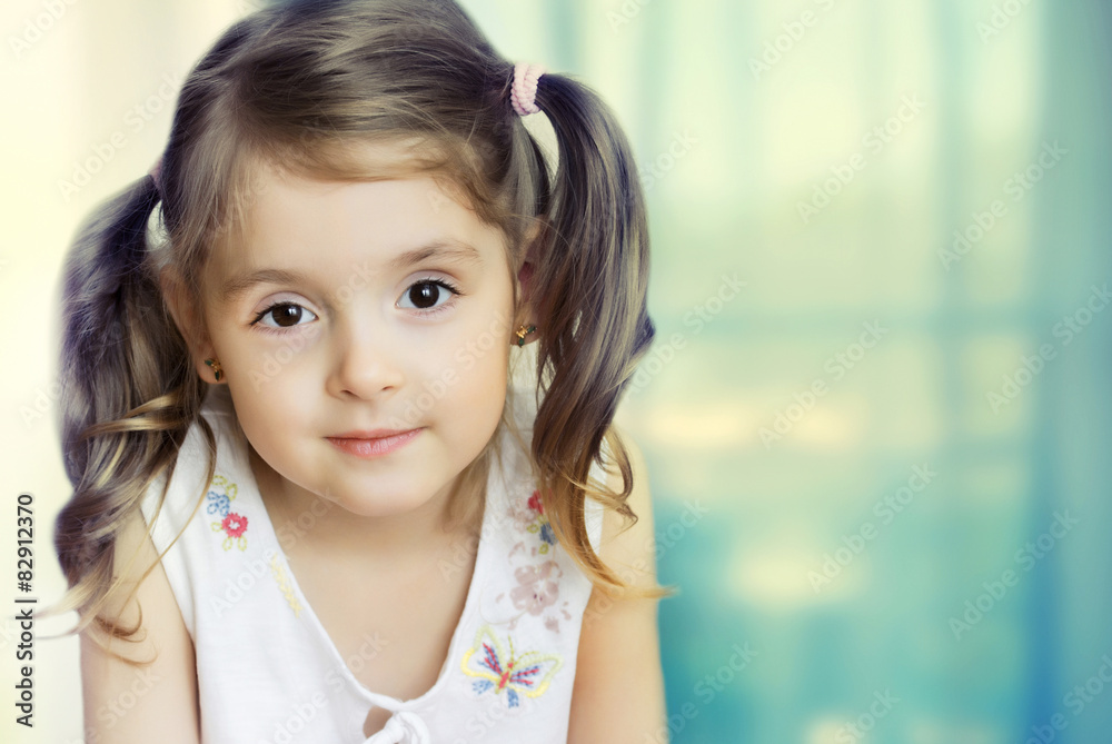 Little girl looking at camera. Small child closeup on backgrou Little girl looking at camera. Small child closeup on backgrou
