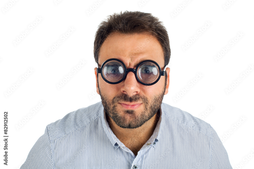 Man with a surprised expression and thick glasses