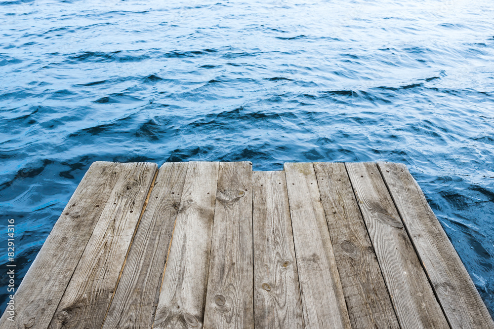 Blue water with empty wooden platform Blue water with empty wooden platform