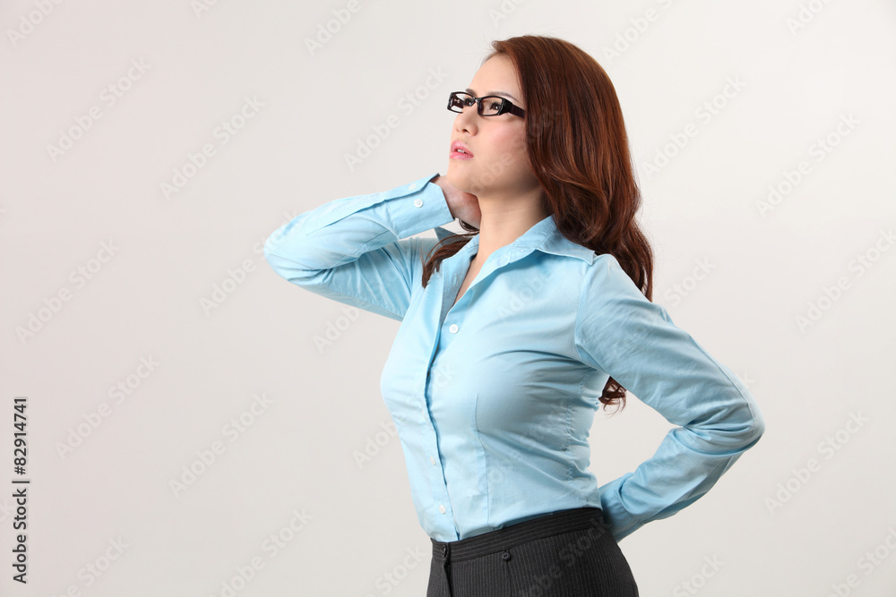 businesswoman suffering from backache and neck ache businesswoman suffering from backache and neck ache