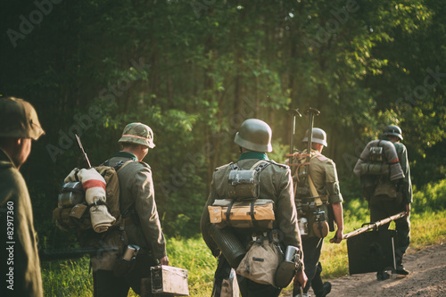 Unidentified reenactors dressed as German soldiers during march photo