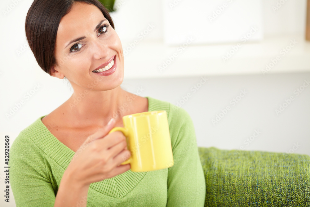 Caucasian woman holding a coffee cup Caucasian woman holding a coffee cup