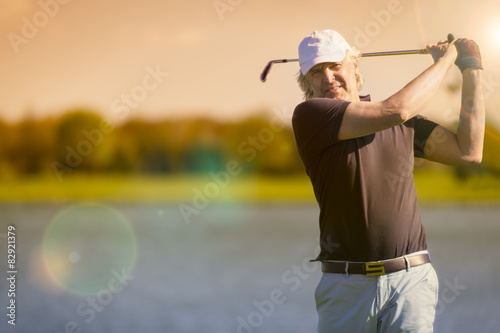 Male senior golfer from front.