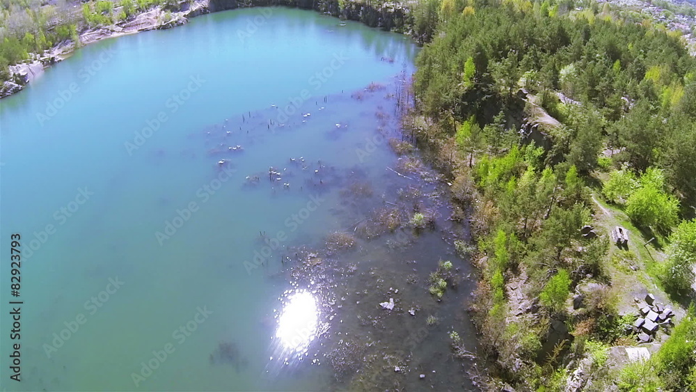 Reflection of sun in canyon with lake. Aerial POV clip Reflection of sun in canyon with lake. Aerial POV clip
