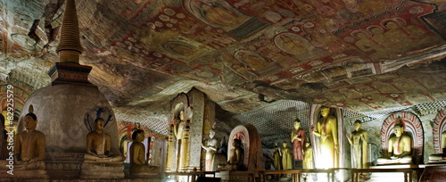 Panorama  with Buddha statue and paint in Dambulla Cave Temple photo