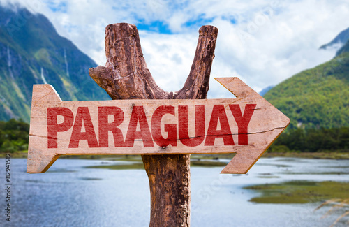 Paraguay wooden sign with mountains background photo