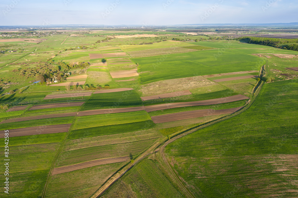 Aerial view of a green rural area under blue sky. Ukraine