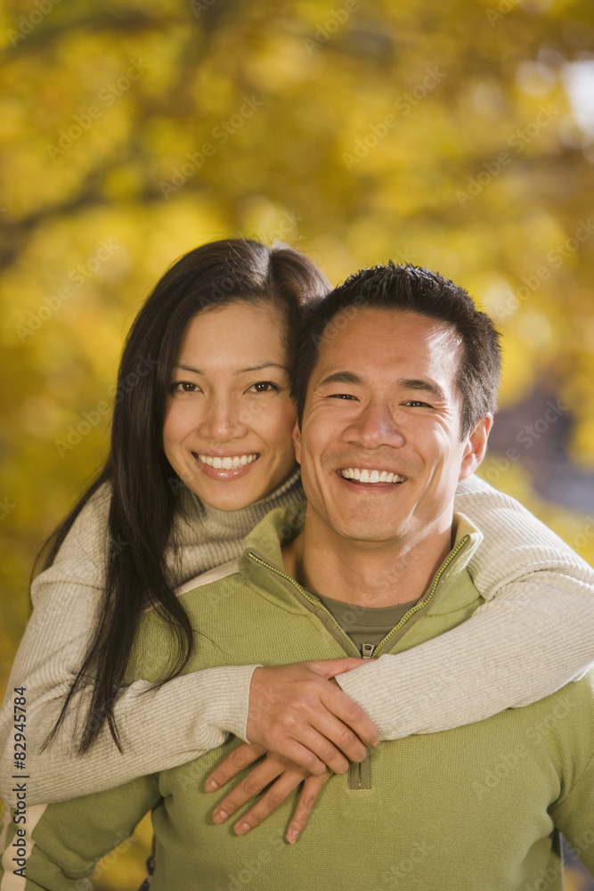 Asian woman hugging boyfriend Asian woman hugging boyfriend